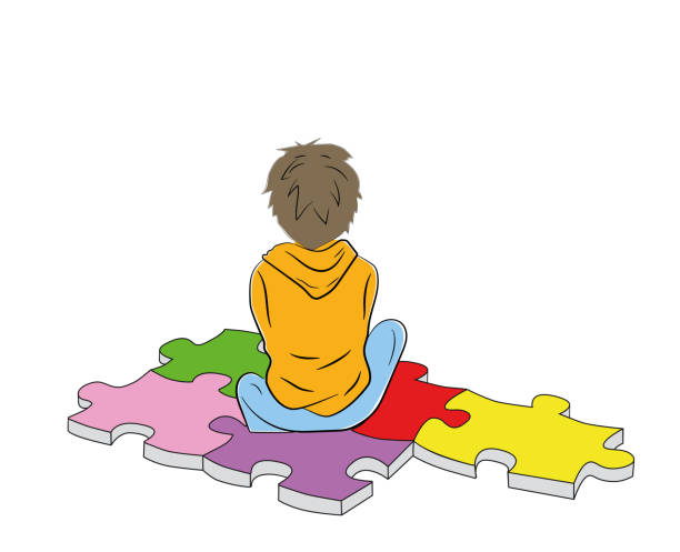 the boy sits on the puzzles symbol of autism. vector illustration.